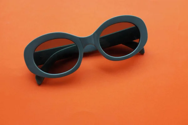 Sunglasses Gray Plastic Frame Isolated Orangebackground Retro Fashion Bold Frame — Stock Photo, Image