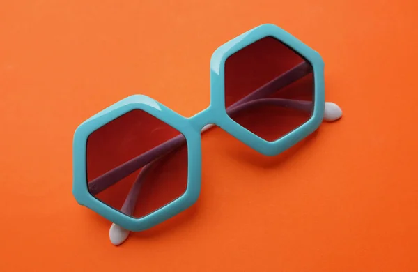 Close Blue Pentagon Shape Sunglasses Isolate Orange — Stock Photo, Image