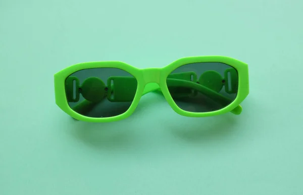 Sunglasses Green Plastic Frame Isolated Green Pastel Background Retro Fashion — Stock Photo, Image