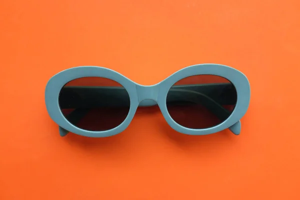 Sunglasses Gray Plastic Frame Isolated Orange Background Retro Fashion Bold — Stock Photo, Image