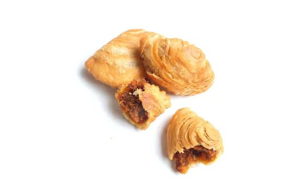deep fried curry puff,curry puff pastry, karipap,epok epok, spiral curry puff isolated a white backdrop  . thai curry puff concept.this pastry is asian traditional snacks
