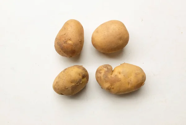 heaps of fresh raw baby potato (Solanum tuberosum) head or Young potato isolate on a white background
