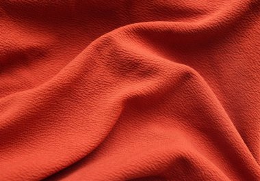 turuncu kumaş dokusu arka plan, buruşuk kumaş kumaş, dalgalı, kumaş pürüzsüz doku yüzeyi, buruşuk kumaş, akıcı kumaş veya arkaplan ve tasarım sanat eserleri, güzel buruşuk desenler