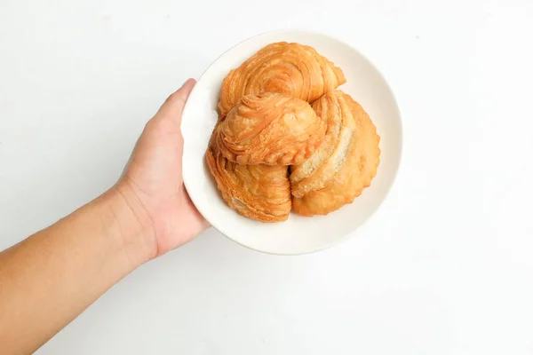 Image of curry puff ,Curry puff pastry, locally known as karipap isolate on a white backdrop.Asian traditional snacks that has crispy shell. Thai crispy curry puff concept.