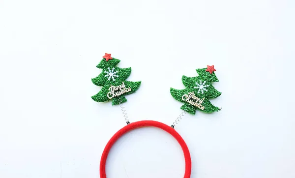 Beautiful headband funny christmas trees isolate on a white backdrop.concept of joyful Christmas party,New year is coming soon, festive season decoration with Christmas elements