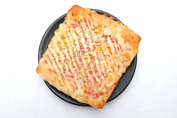 Appetizing Homemade pizza bread with ketchup, mayonnaise, boiled corn sausage and cheese isolate on a white backdrop.healthy breakfast ideas