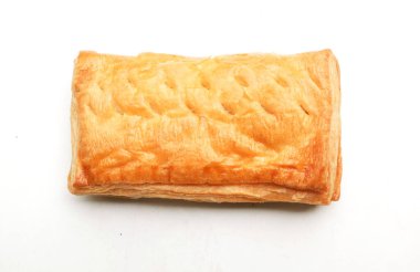 Image of Appetizing closely packed fresh square shaped puff pastry biscuit snacks with puffed crispy golden brown crust layersa  isolate on a white backdrop. Traditional Asian dessert or breakfast