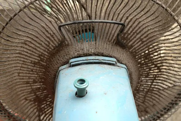 stock image close up dirty and dust on floor fan , fan blades. impact on the air, allergies to health,unhealthy air flow for respiratory system. cleaning and hygiene care concepts