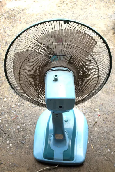 Stock image close up dirty and dust on floor fan , fan blades. impact on the air, allergies to health,unhealthy air flow for respiratory system. cleaning and hygiene care concepts