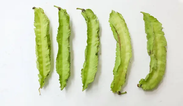 stock image fresh raw green Winged bean, (Psophocarpus tetragonolobus) isolate on a white backdrop. vegetables 