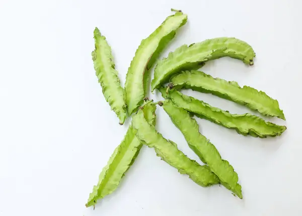 stock image fresh raw green Winged bean, (Psophocarpus tetragonolobus) isolate on a white backdrop. vegetables 