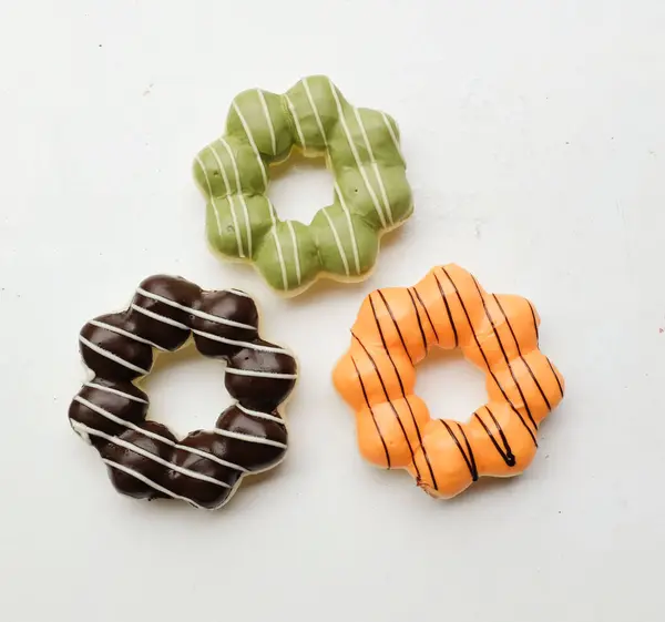 stock image set of colorful donuts,collection of donut image. various types of donuts in glaze and chocolate,milk, thai tea, green tea, isolate on a white backdrop