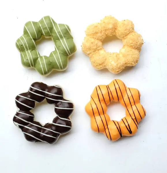 stock image set of colorful donuts,collection of donut image. various types of donuts in glaze and chocolate,milk, thai tea, green tea, isolate on a white backdrop