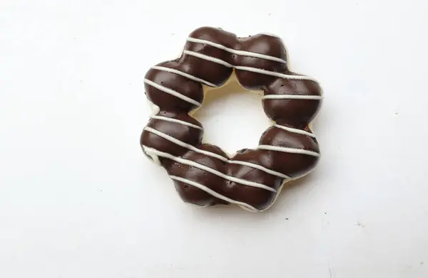 stock image fresh donuts in multi-colored  donuts glaze chocolate flavor, colorful donuts,sweet colored donuts, Thai tea flavor frosted coating  isolate on a white backdrop