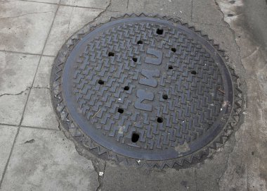 top view and flat lay a pipe cap circle, black iron rust on the street on the road in  clipart