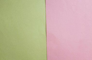 Arka plan için iki ton sarı pastel ve pembe kağıt rengi. Zeminde iki renkli kağıt vardı ve görüntünün yarısını böldü. arkaplan. Metin için yer alan üst görünüm