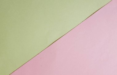 Arka plan için iki ton sarı pastel ve pembe kağıt rengi. Zeminde iki renkli kağıt vardı ve görüntünün yarısını böldü. arkaplan. Metin için yer alan üst görünüm