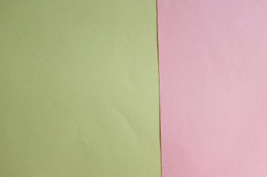 Arka plan için iki ton sarı pastel ve pembe kağıt rengi. Zeminde iki renkli kağıt vardı ve görüntünün yarısını böldü. arkaplan. Metin için yer alan üst görünüm