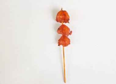 appetizing a chicken butt grilled ,chicken grilled skewered on bamboo isolate on a white backdrop . halal food, street food in thailand