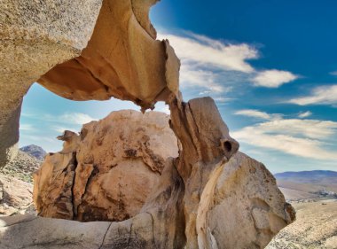 Natural stone arch eroded by wind known as Arco de las Penitas, Fuerteventura, Canary Islands, Spain