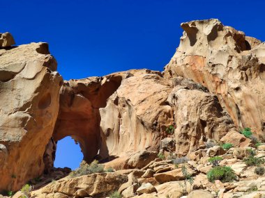 Natural stone arch eroded by wind known as Arco de las Penitas, Fuerteventura, Canary Islands, Spain