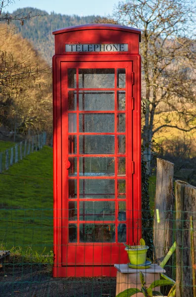 A traditional english red phone booth in Candaneu village, Asturias, Spain