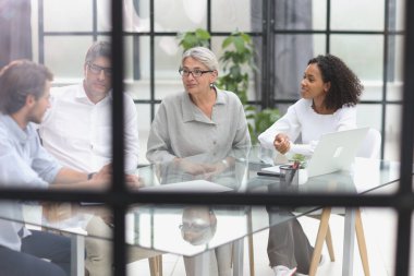 discussion of business people in the office sitting at the table
