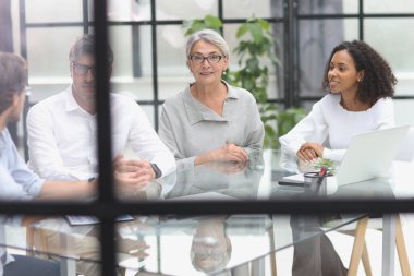 discussion of business people in the office sitting at the table