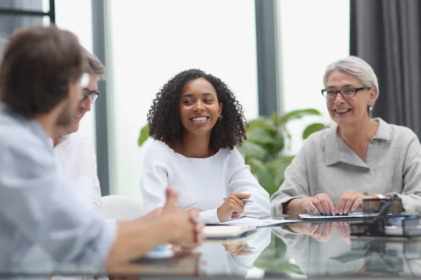 stock image negotiations between managers and employees in the office at the table