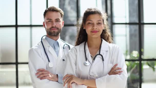 Two Confident Doctors Standing Practice Arms Crossed — Video Stock