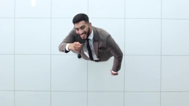 successful business man. Young businessman pointing at his business partner while standing