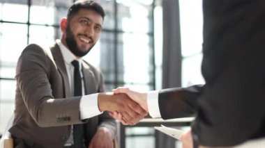 Cropped view businessman shaking hands with colleague