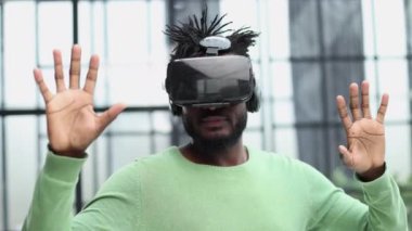 A man is looking for bright impressions using gadgets.