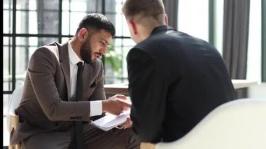 Cropped view businessman shaking hands with colleague