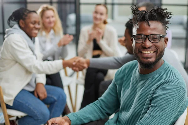 stock image African businessman with a group of businessmen in the background