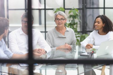 discussion of business people in the office sitting at the table