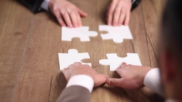 Group Business People Putting Together Puzzle Table — Stock Video