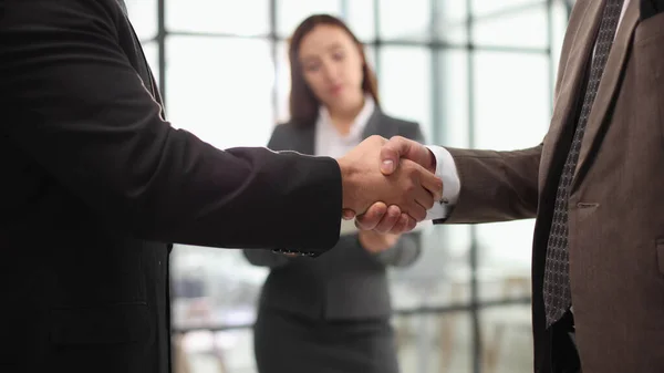 Business people, handshake or greeting in hotel lobby, modern office or airport