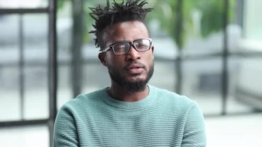 Portrait of a serious african american man, shaking his finger, warning and preventing you from something bad