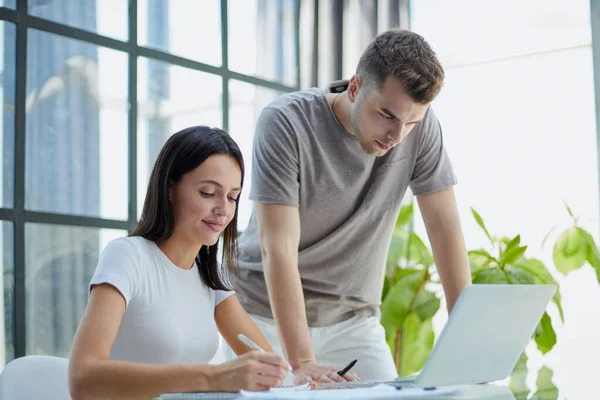 stock image male ceo executive manager mentor giving consultation on financial operations to female colleague intern using laptop sitting in modern office