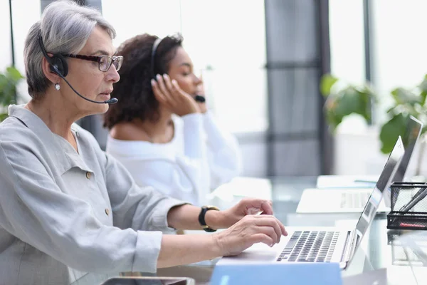 stock image businesswoman working with a headset and accompanied