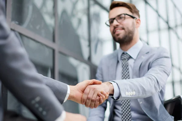 stock image Closeup of business shaking hands over a deal