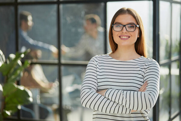Young white business woman smiling at camera
