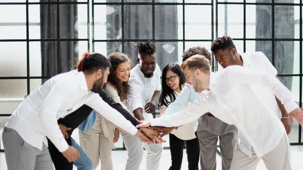 Teamwork and team spirit ,handshake in a group after work succe