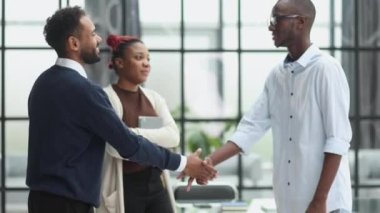 Handshake of businessmen with buyers after a successful deal in the office