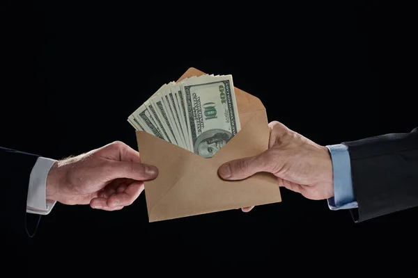 Man giving bribe money, closeup of hands