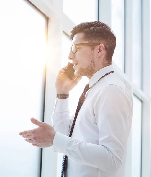 stock image bearded man talking on phone and smiling