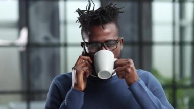 concep african american businessman calling on smartphone at office