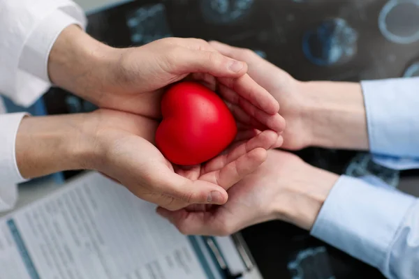 Doctor Showing Compassion Support Holding Red Heart — Stock Photo, Image