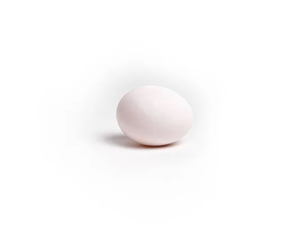 Белое Яйцо Лежит Белом Фоне — стоковое фото